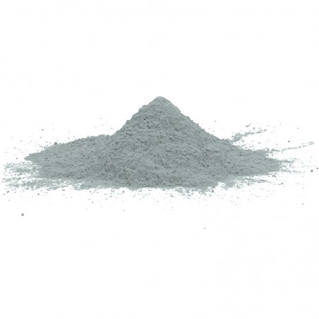 A mound of fine gray powder rests on a plain white surface, suggesting a raw material or construction component.
