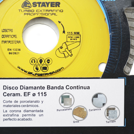 Une lame de scie circulaire jaune étiquetée « STAYER Turbo Extrafino Profesional » conçue pour couper la céramique et la maçonne