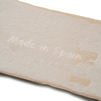 Rectangular, off-white tile with a textured surface. The text `Made in Spain` is subtly etched across the tiles center.