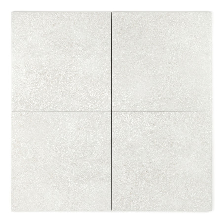 Four light gray, speckled ceramic tiles are arranged in a square, neatly aligned, forming a seamless pattern with thin, visible 