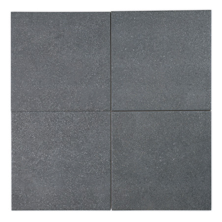 Four gray square tiles are arranged in a 2x2 grid, forming a pattern with subtle speckles. The smooth tiles suggest a minimalist