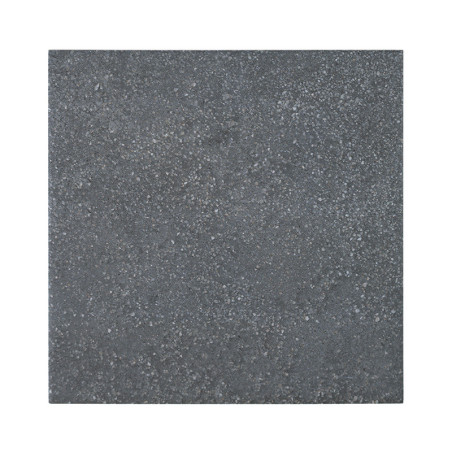 A square tile, with a textured, dark gray surface, rests against a plain white background.