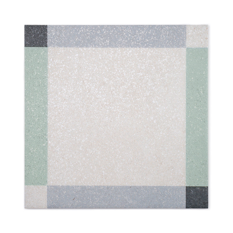 A square tile shows a geometric border pattern with black, gray, and green sections surrounding a textured off-white center, sug