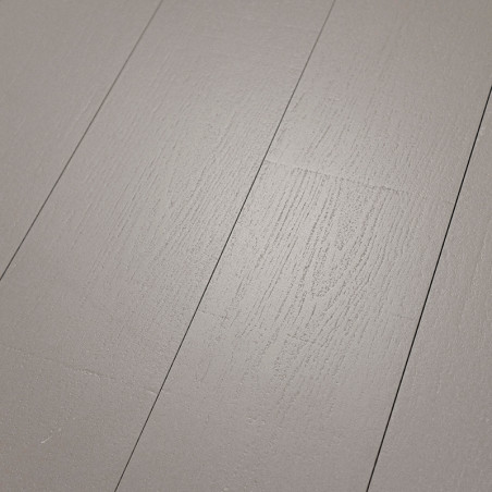 Gray wood-like tiles lie flat, showcasing subtle grain patterns, creating a smooth, modern surface in an interior flooring conte