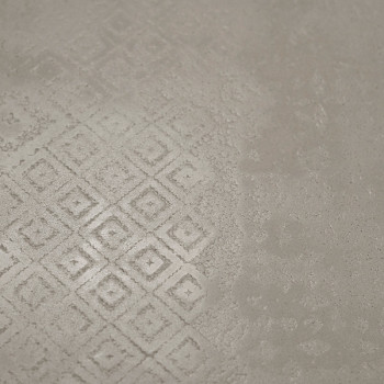 Le carreau présente un motif géométrique subtil de losanges en relief, créant une surface texturée sur un fond lisse et neutre.