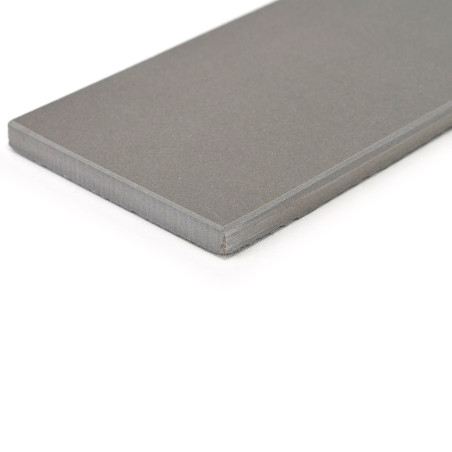 A rectangular, smooth, dark gray ceramic tile lies flat against a white background, showcasing its bevelled edge and uniform tex