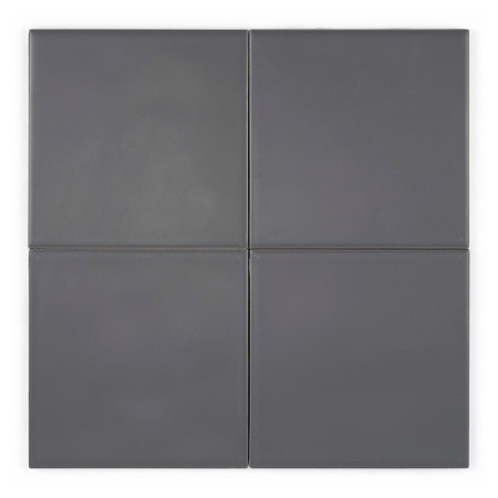 Cuatro mosaicos cuadrados de color gris oscuro dispuestos en una cuadrícula de dos por dos, creando una superficie lisa y sin co