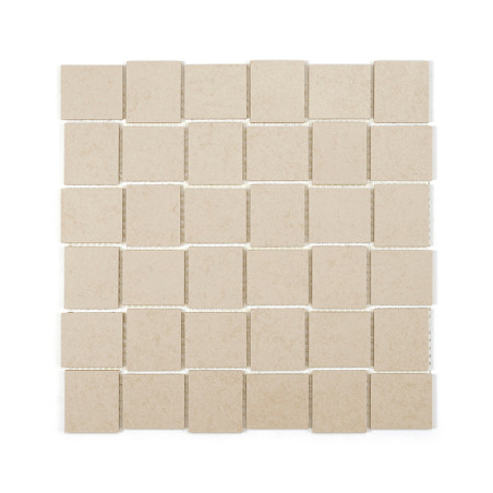 Square beige tiles are arranged in a grid, creating a uniform, textured pattern on a flat surface against a white background. Square beige tiles are arranged in a grid, creating a uniform, textured pattern on a flat surface against a white background.