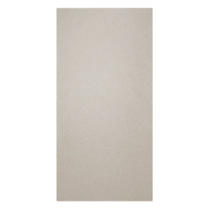 A rectangular beige tile lies flat, exhibiting a smooth, matte finish. it is set against an undefined, plain backdrop.