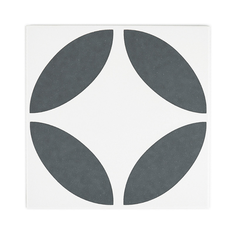 Um ladrilho quadrado apresenta quatro formas ovais cinza escuro, posicionadas simetricamente para formar um padrão em forma de c