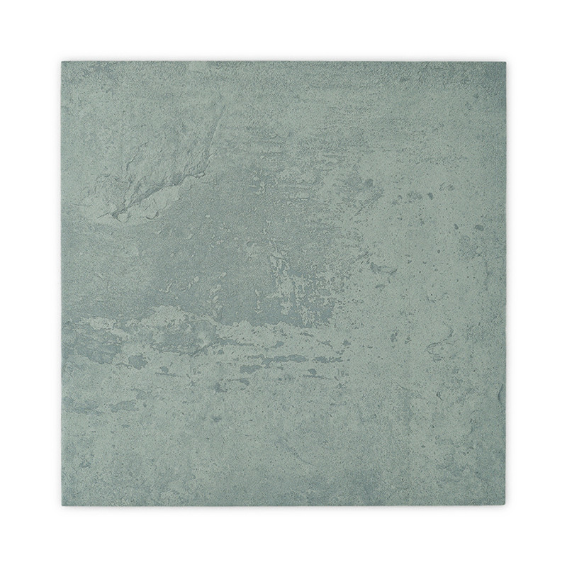 A square tile displays a mottled, textured surface in muted green tones, reminiscent of natural stone, set against a plain, whit