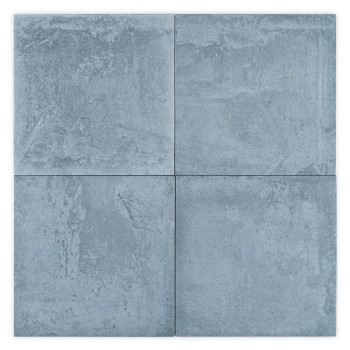 Un carreau carré à la texture rugueuse et inégale affiche des teintes tachetées de gris et de bleu, ressemblant à de la pierre n
