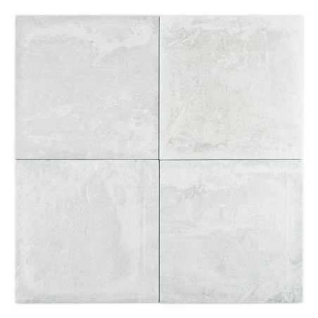 A set of four light gray, textured ceramic tiles arranged in a square, exhibiting a subtle, weathered pattern, suitable for floo A set of four light gray, textured ceramic tiles arranged in a square, exhibiting a subtle, weathered pattern, suitable for floo