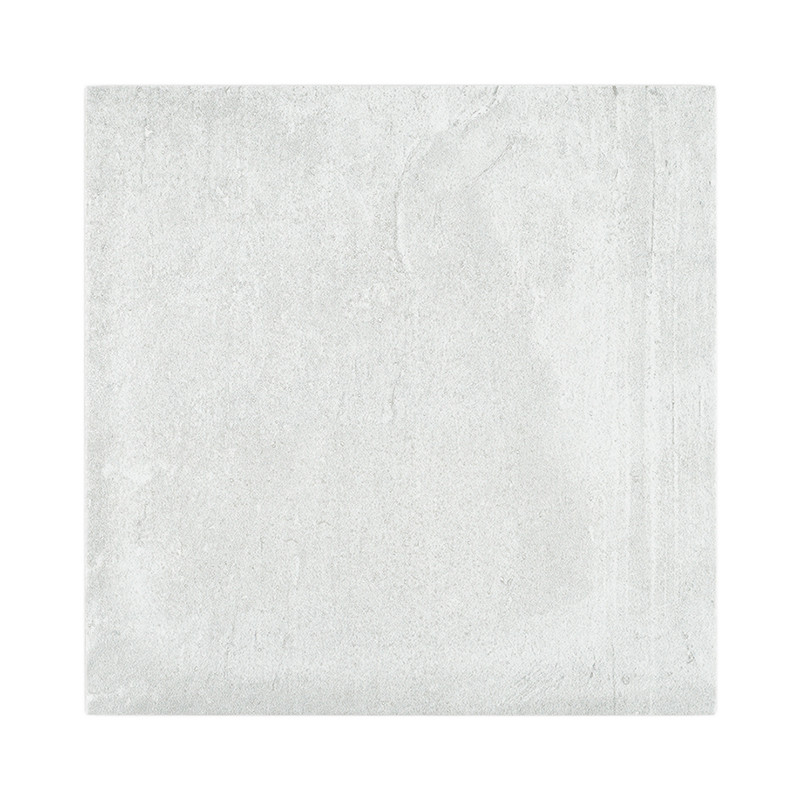 Un carreau carré gris clair lisse avec une texture subtile. il semble uniforme, suggérant une utilisation dans des conceptions a