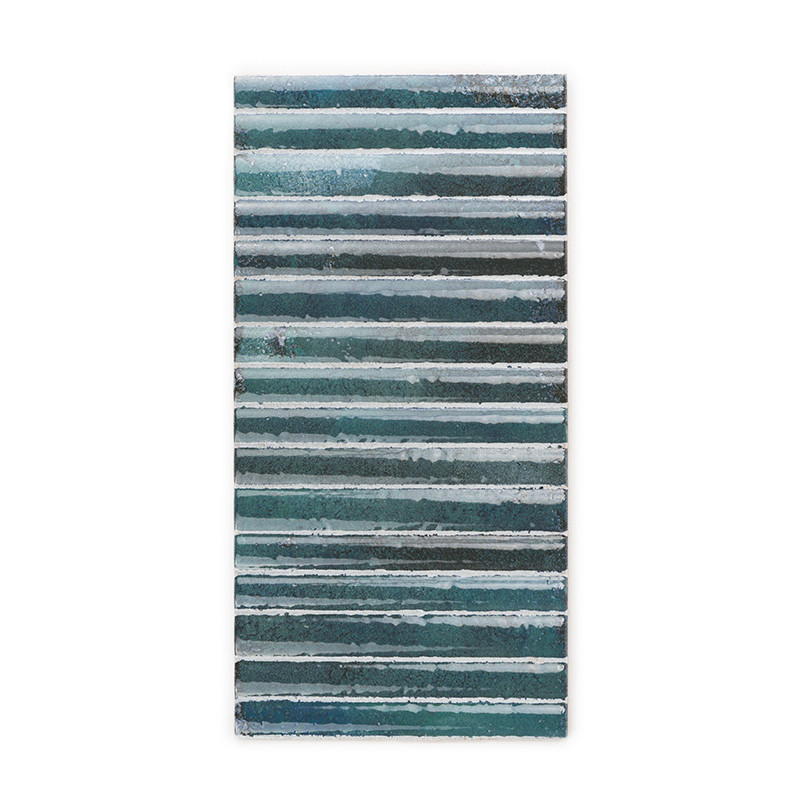 Rectangular tile displays alternating horizontal stripes in shades of teal, blue, and gray. textured surface provides a visually