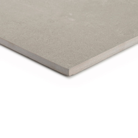 A beige, square tile rests flat with its smooth surface exposed, edges slightly beveled, against a white background. No text is 