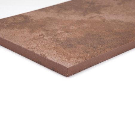 A rectangular brown tile rests on a white surface, showcasing a slightly textured matte finish and beveled edges. A rectangular brown tile rests on a white surface, showcasing a slightly textured matte finish and beveled edges.