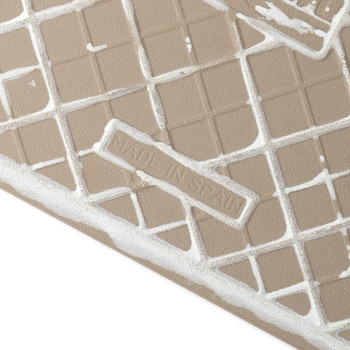Le carreau marron présente un motif de grille texturé avec des taches blanches irrégulières, disposées en diagonale. « MADE IN S