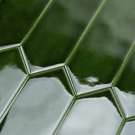 Glossy green tiles form a geometric pattern, creating a reflective surface in a uniform arrangement, suggesting a modern, sleek 