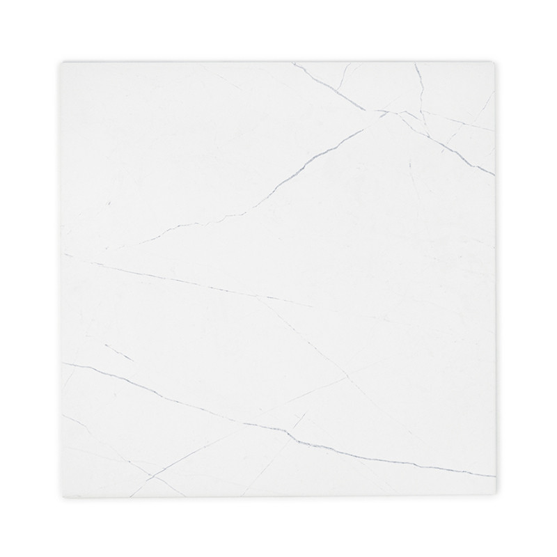 A square, white ceramic tile features subtle, dark gray veining, resembling marble. It lies flat against a plain, white backgrou
