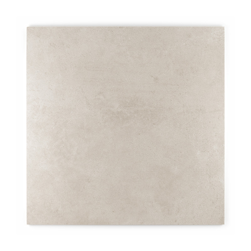 Le carreau présente une surface lisse et mate de couleur beige clair, d'apparence uniforme et texturée, adaptée à une utilisatio