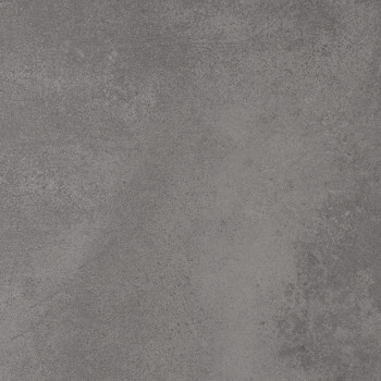 Un carreau texturé gris mat présente des taches et des dégradés subtils, ressemblant à du béton. il imite un environnement indus