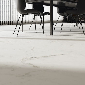 White marble tile spans the floor, adding elegance under a modern dining table with black chairs. Sunlight filters through verti