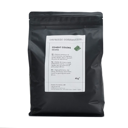 Sac noir scellé étiqueté « connexion céramique » contenant 4 kg de ciment de couleur verte, avec des instructions de mélange dét