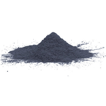A mound of fine gray powder rests on a smooth, white surface, with loose particles scattered around.