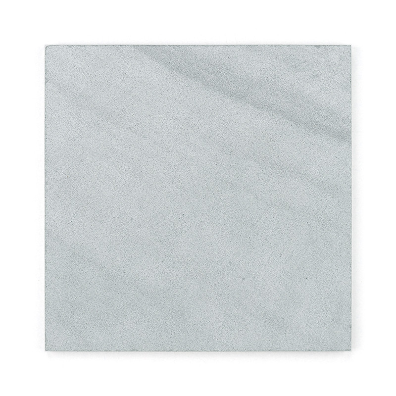 Square stone tile. displaying a mottled light gray surface. set isolated on a plain white background.