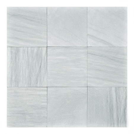 Nine smooth, light gray stone tiles arranged in a square grid, displaying subtle, varied patterns, against a plain backdrop.