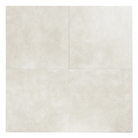 Un carreau de céramique beige clair présente quatre carrés distincts dans son périmètre, présentant une surface texturée subtile