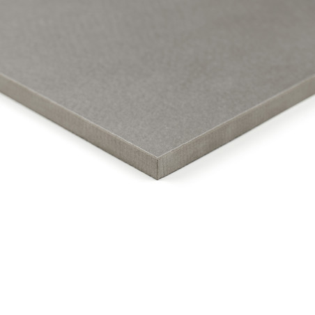 A gray, smooth, square tile lies flat on a white surface, showcasing its clean, sharp edges and corner detail.