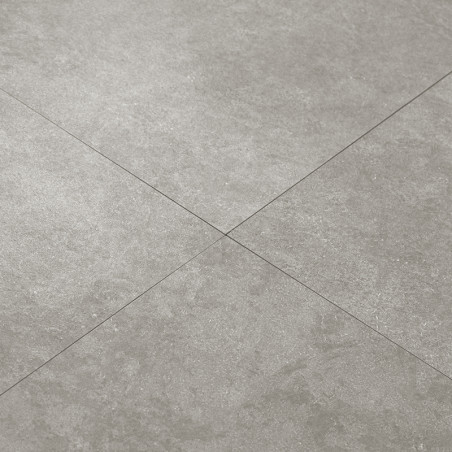 Quatre carreaux carrés gris clair forment un motif de grille homogène, affichant une texture lisse semblable à celle de la pierr