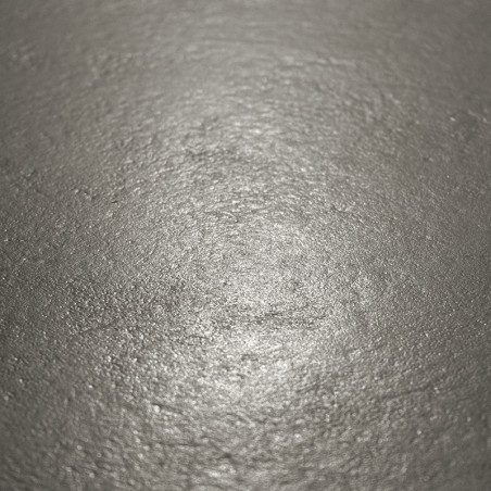 The metallic tile surface reflects light softly, displaying a slightly uneven texture in a neutral, dimly lit setting. The metallic tile surface reflects light softly, displaying a slightly uneven texture in a neutral, dimly lit setting.