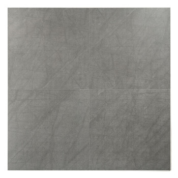 Un carreau carré présente une surface lisse et grise marbrée, suggérant une texture de pierre ou de béton. Le fond est blanc uni