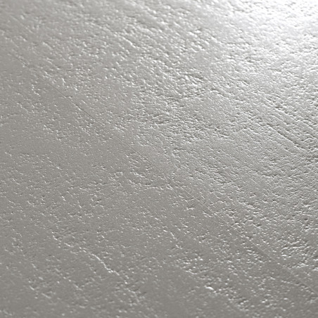 A smooth, matte ceramic tile with a subtle, textured surface resembling soft waves. light reflects gently across the gray-toned 