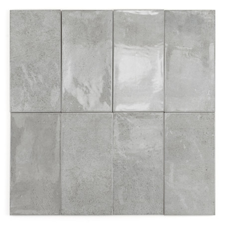 Los azulejos grises rectangulares forman una cuadrícula de tres por tres. Cada azulejo presenta un acabado brillante con sutiles