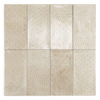 Les carreaux rectangulaires présentent un motif répétitif de formes de losanges beiges imbriqués, créant une apparence texturée 