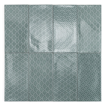 Un carreau rectangulaire affiche un motif géométrique de diamants entrelacés dans diverses nuances de sarcelle, sur un fond blan