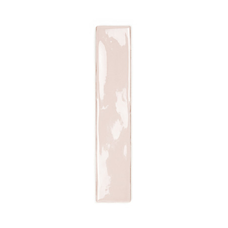 A glossy, rectangular ceramic tile with a narrow, elongated shape, appears in a light beige color against a plain white backgrou