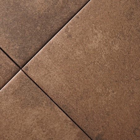 Brown ceramic tiles with a matte finish intersect diagonally, forming a grid pattern in a neutral interior flooring context. Brown ceramic tiles with a matte finish intersect diagonally, forming a grid pattern in a neutral interior flooring context.