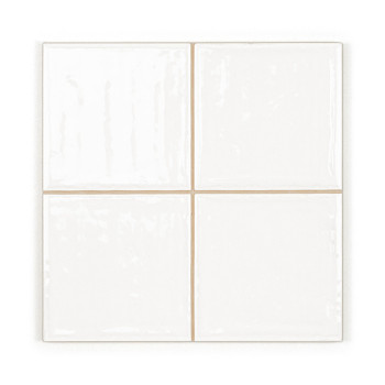 Quatre carreaux carrés blancs brillants sont disposés dans une grille 2x2, affichant une surface uniforme et lisse dans un décor