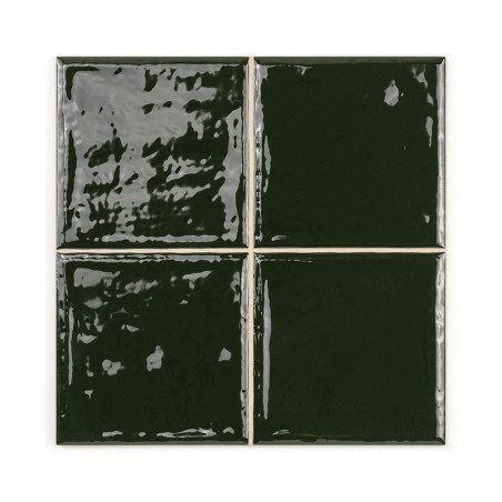 Four glossy, dark green ceramic tiles, reflecting light, are arranged in a square grid, emphasizing their smooth, shiny surface.