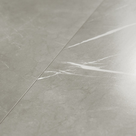 Gray marble tile exhibits subtle white veining, creating a sleek pattern across a smooth surface. positioned in an indoor settin