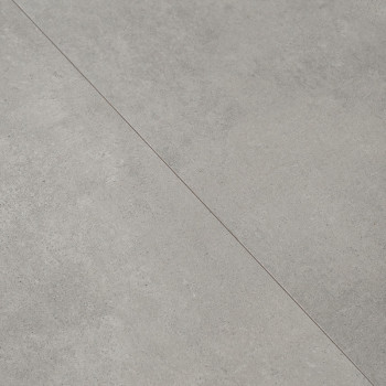 Dois ladrilhos cinza claro reunidos em uma costura. eles apresentam uma superfície de textura sutil com um padrão levemente manc