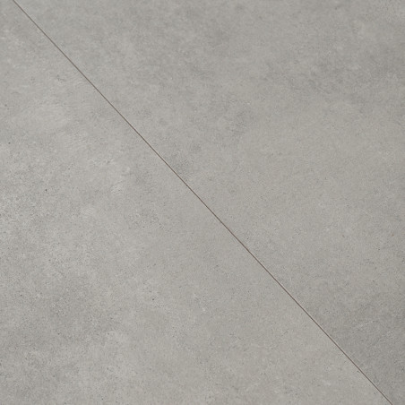 Deux carreaux gris clair se rejoignant au niveau d'une couture. ils présentent une surface texturée subtile avec un motif légère