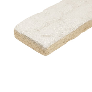 Rectangular terracotta tile sits stationary, showcasing a textured cream surface with rough edges. isolated on a white backgroun