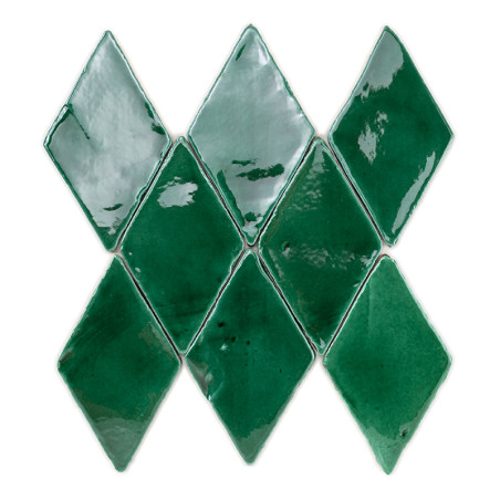 Green, glossy terracotta tiles are arranged in a diamond pattern, creating a symmetrical and reflective geometric design.
