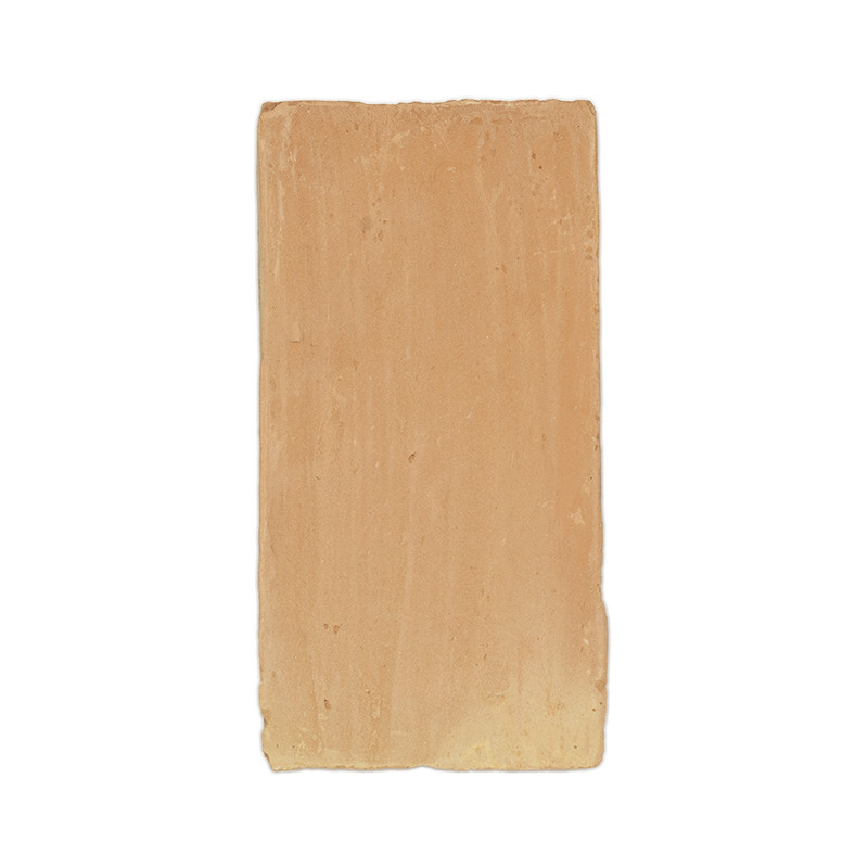 Terracotta tile, rectangular and smooth, resting against a plain white background.